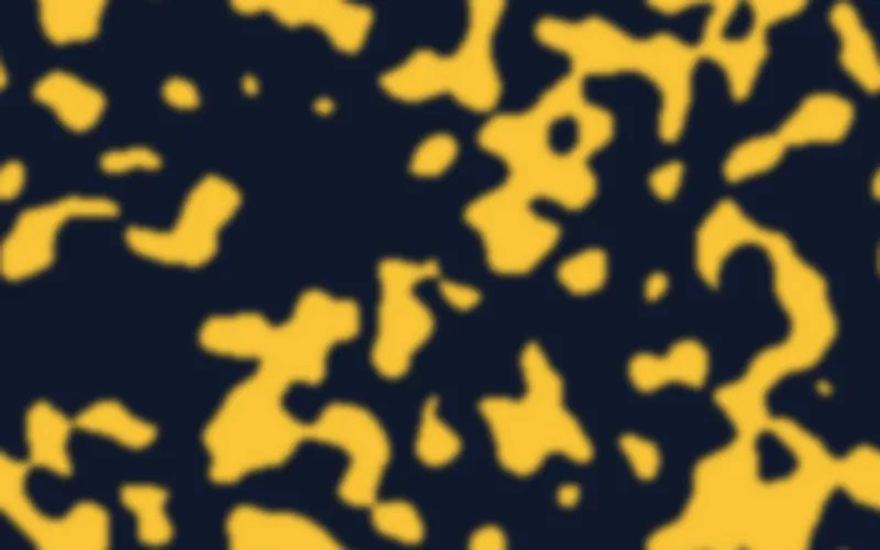 Motif de Turing organique : des taches et structures coralliennes ambre sur un fond bleu nuit.